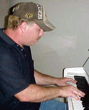 Ron Hamrick playing piano - he and Alison both brought their musical talent which enhanced our experience.